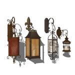 4 different types of wrought iron candle lanterns.