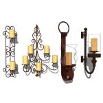 4 different wrought iron wall candle holders.