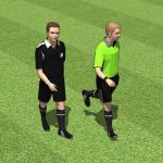 Two soccer referees.
Note: Soccer field can be fo...
