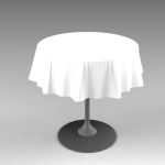 Small cafe table with tablecloth