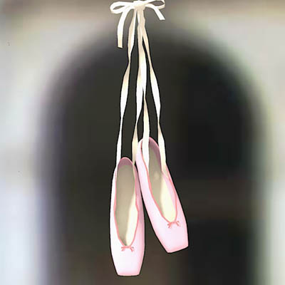A pair of hanging ballet shoes. 