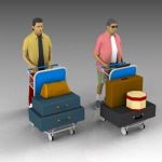 Men with baggage on airport trollies