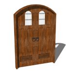 A rustic wood spanish style front door with wrough...