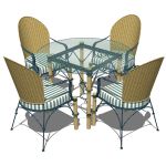 Wrought iron and wicker dining table and chairs by...