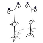 Wrought iron sun and moon standing candle holders....